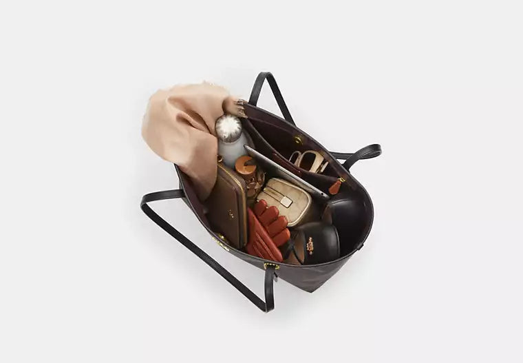 Coach Bolso City Tote en lona de la firma