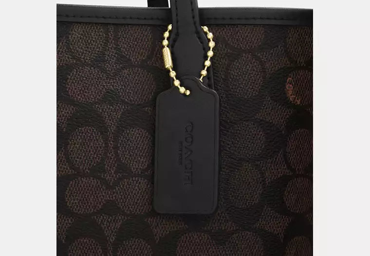 Coach Bolso City Tote en lona de la firma