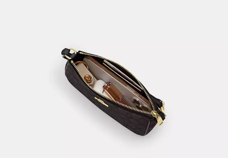 Coach Nolita 19 en lona de firma
