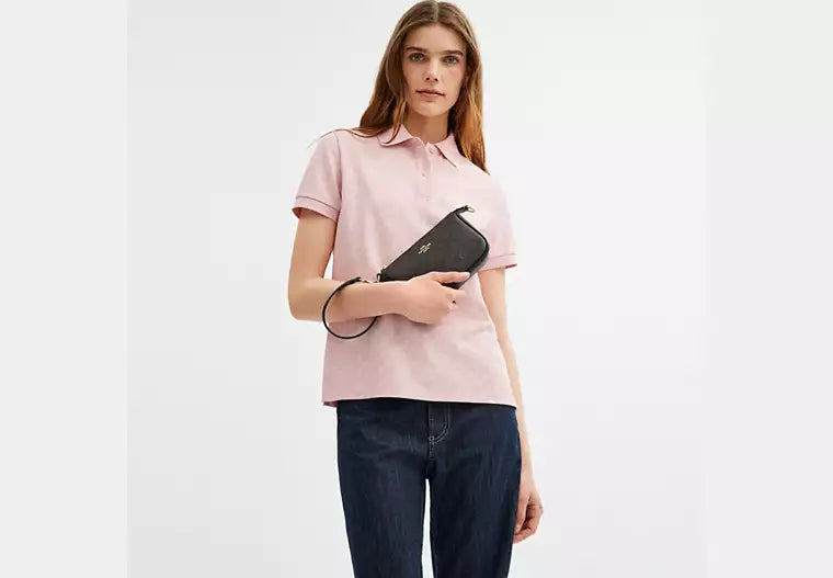 Coach Nolita 19 en lona de firma