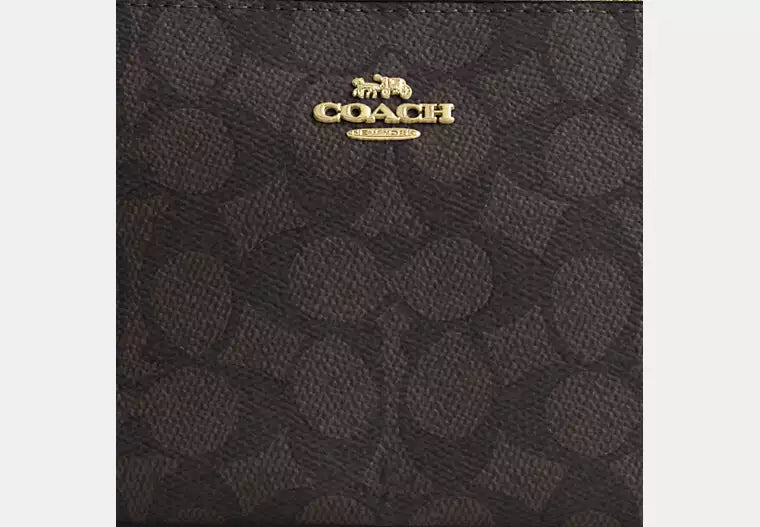 Coach Nolita 19 en lona de firma